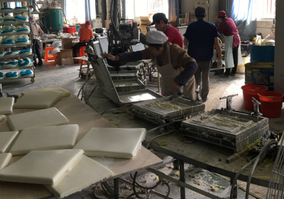 Compressed Memory Foam Pillows A stack of compressed memory foam pillows ready for shipping